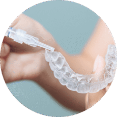dental-patient-using-teeth-whitening-tray dental patient using teeth whitening tray