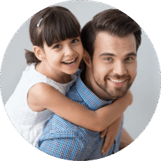 father and daughter smiling