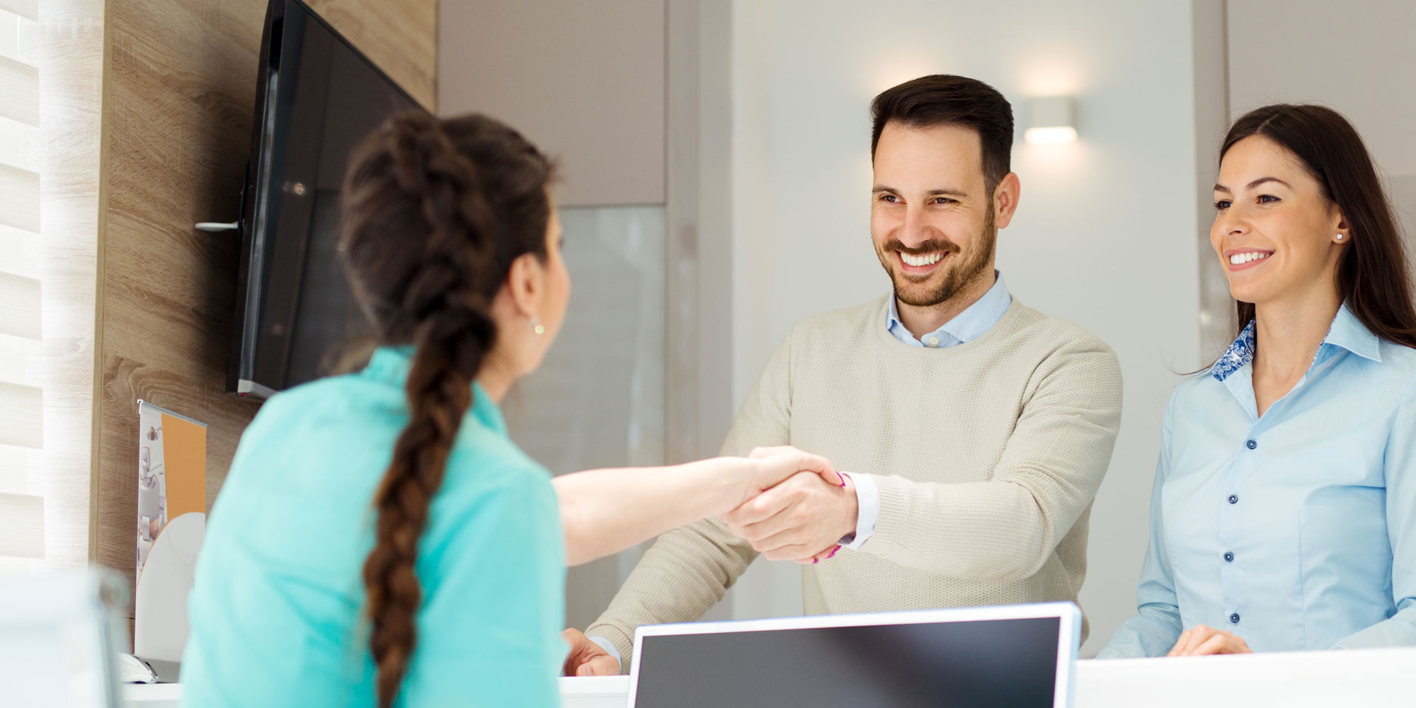 office-manager-welcoming-dental-patients office manager welcoming dental patients