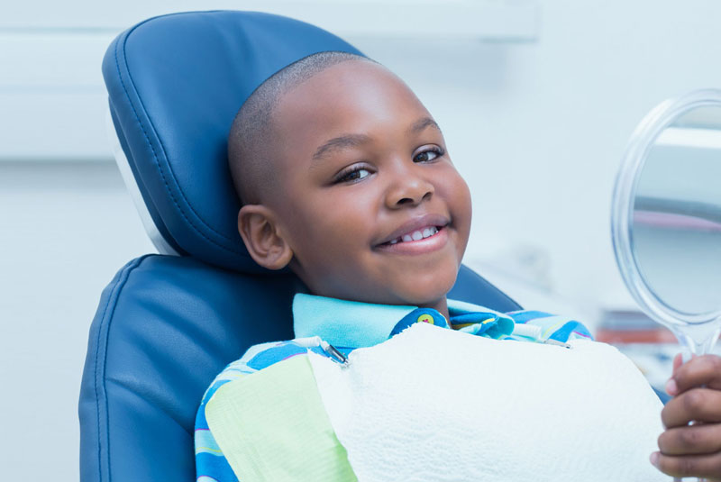 young dental patient smiling after procedure