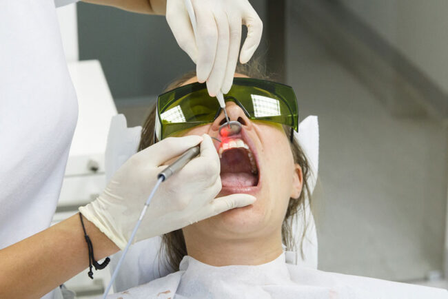 dental-patient-undergoing-laser-procedure Dental Patient Undergoing Laser Gum Procedure