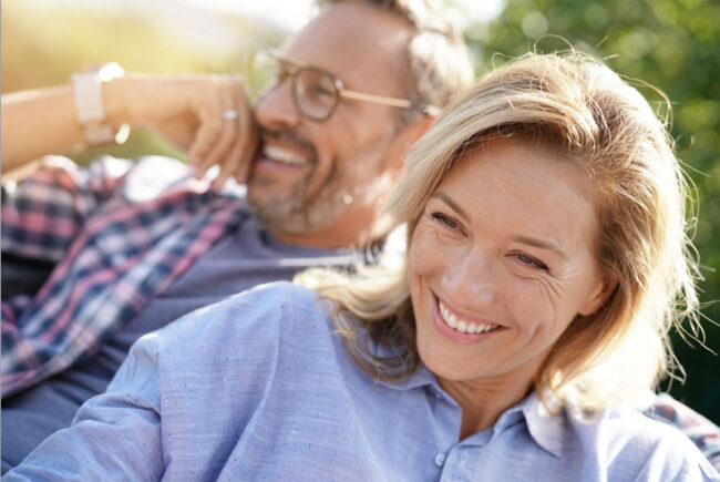 full-arch-dental-implants-patient-smiling Full Arch Dental Implant Patients Smiling Together