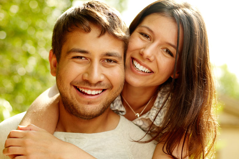 Dental Patients Smiling With Well Cared For Dental Implants In Westminster, CO