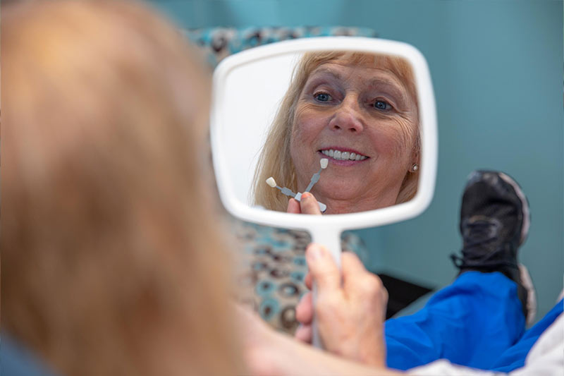 veneers patient seeing her new smile