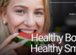 woman taking a bite of a watermelon slice