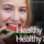 woman taking a bite of a watermelon slice
