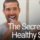 man brushing teeth in mirror
